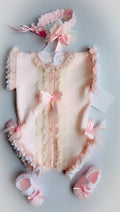 Baby knitted pink romper and hairpiece