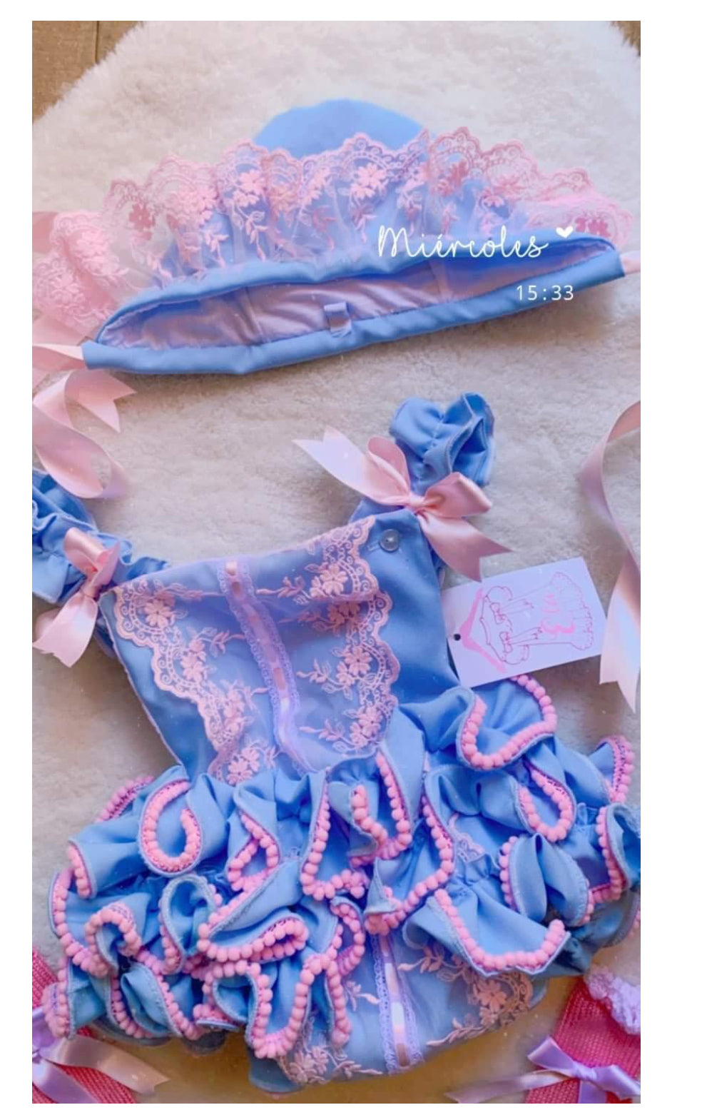 Ela ruffle romper blue and pink